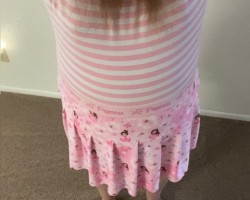 My new pink striped onsie and princess skirt. Yes, I'm diapered underneath. It's great being a little gurl Heart