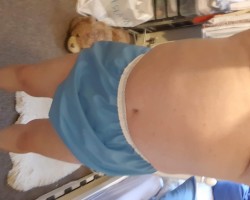 Blue rubber pants over wet terry towlling nappy from the night before