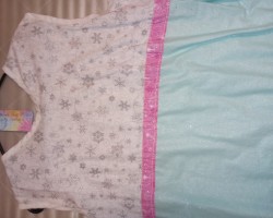 Winter Snowflake Sparkle dress. It has Sparkling Silver snowflakes, sparkling minty green, and sparkling pink wisp's.