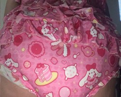My new pink ruffle butt onsie. Yes, I'm diapered and love it. Just wish I had a daddy to enjoy a little gurl like me.