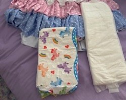 My new diaper cover came in a day early. going to pair it with a pretty rainbow diaper and booster pad.