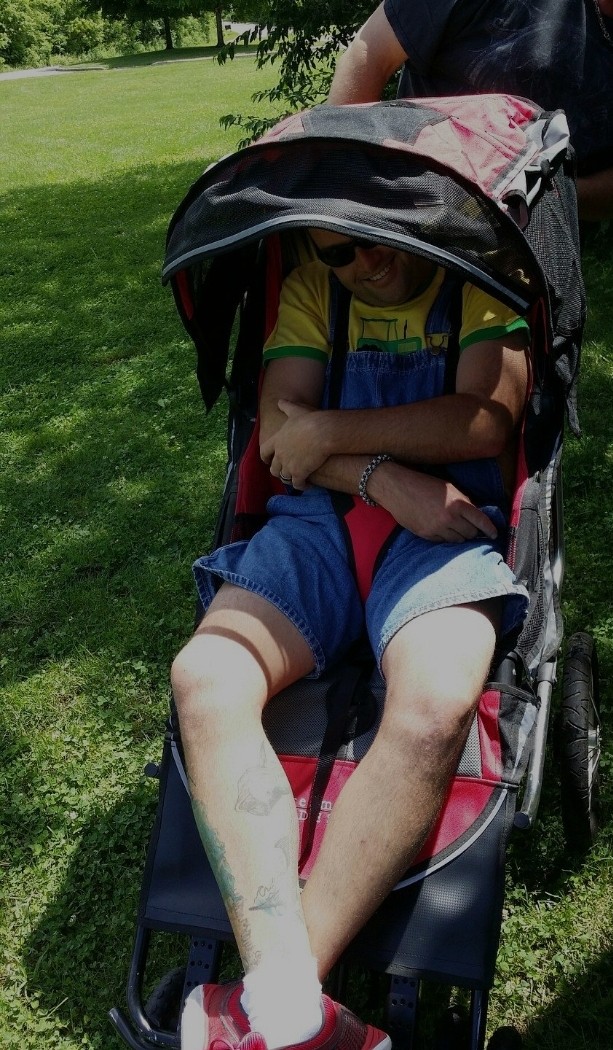 <p>Being pushed in the stroller at a park</p>