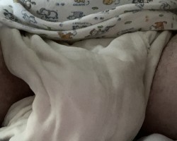 Baby in leaking soaked diaper
