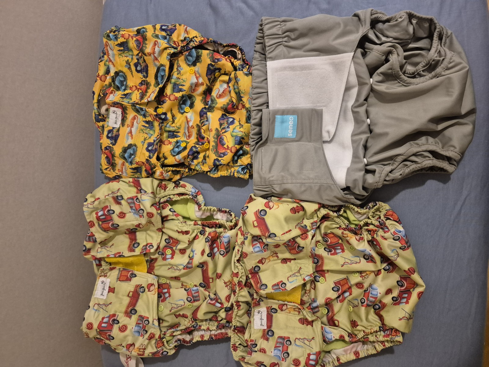 <p>My current stash of cloth diapers.<br/>3x pocket diapers from pupus and inserts.<br/>3x Ai2 diapers from Seneo and inserts<br/>Planning on getting more pocket ones, to be able to wear full time.</p>