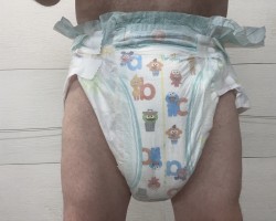 Baby in pampers soaked diaper