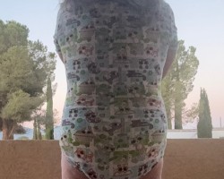 Enjoying the morning air in just a wet diaper and onsie while the coffee is brewing.